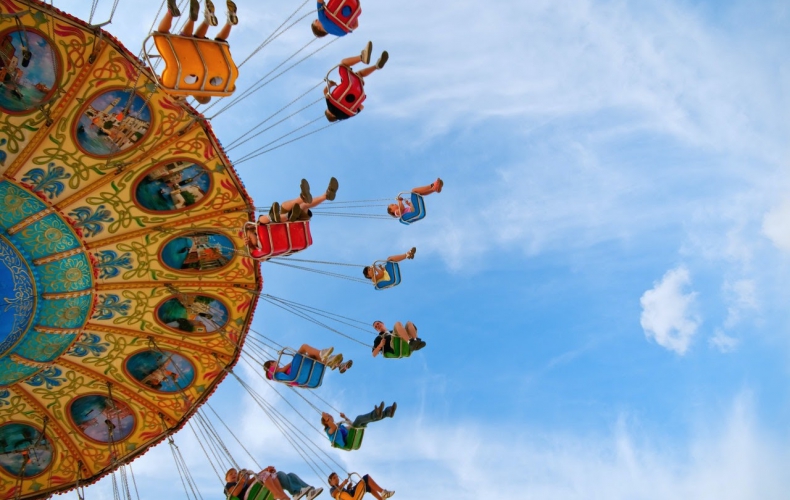 patrons enjoying an amusement park after COVID-19