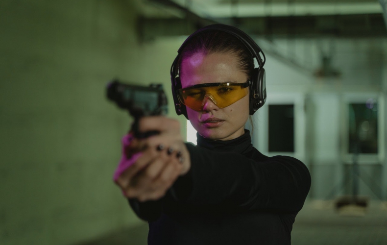 a woman at a shooting range