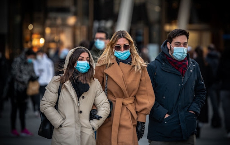 Group of people wearing COVID-19 face masks