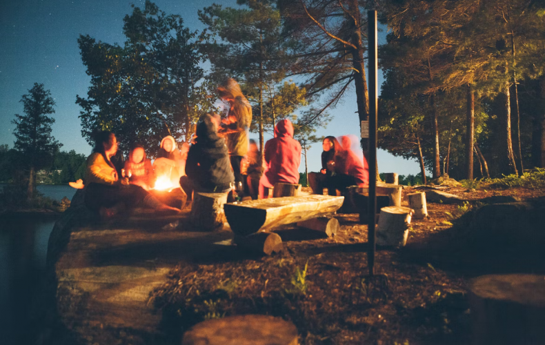 Children sitting in front of a campfire