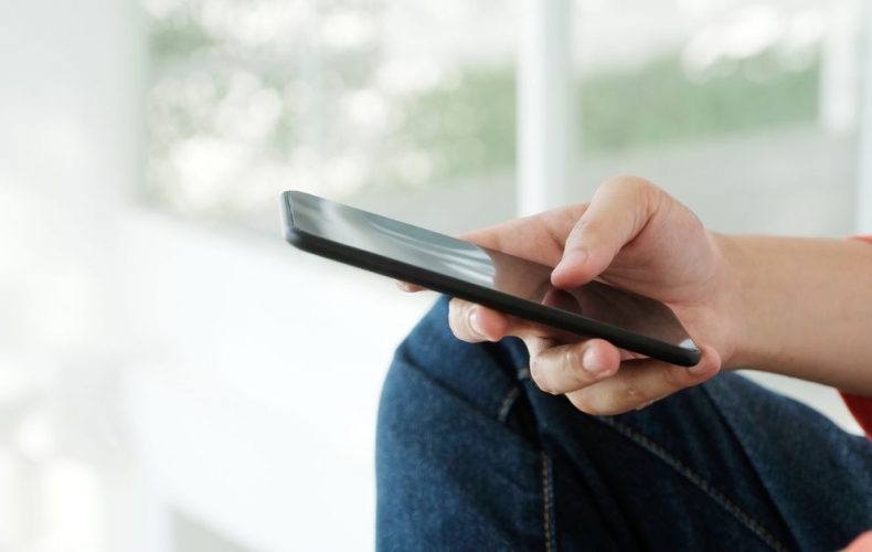 Person filling out an online form on a phone