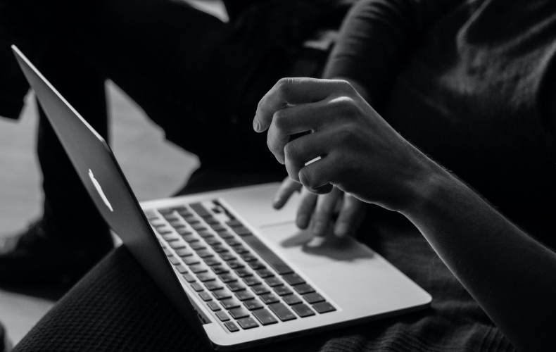 person typing on the laptop